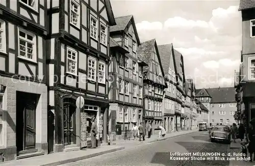 AK / Ansichtskarte Melsungen_Fulda Kasseler Strasse mit Blick zum Schloss Fachwerkhaeuser Altstadt Melsungen Fulda