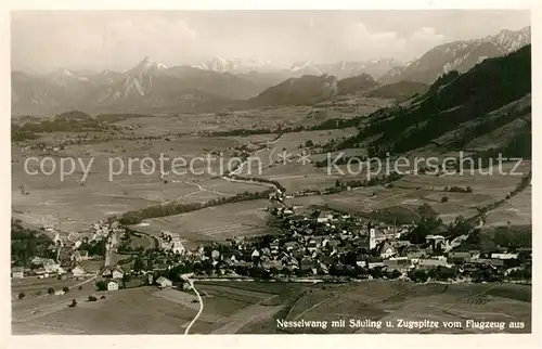 AK / Ansichtskarte Nesselwang mit Saeuling und Zugspitze Fliegeraufnahme Nesselwang