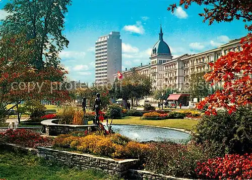 AK / Ansichtskarte Interlaken_BE Park und Hoeheweg Skulpturen Hochhaus Interlaken_BE