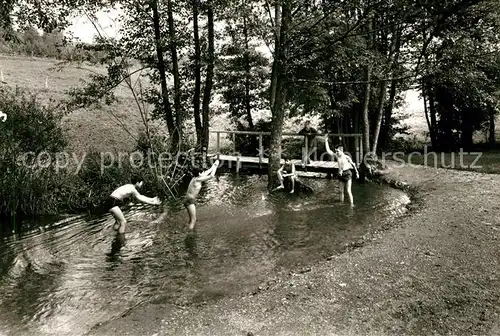 AK / Ansichtskarte Deisendorf Kinderheim Partie am Bach Holzbruecke Deisendorf