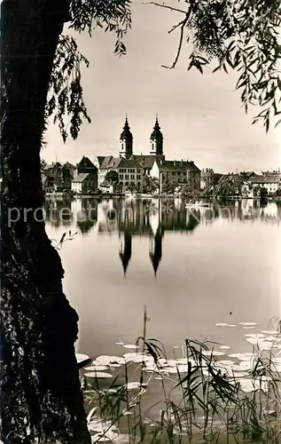 AK / Ansichtskarte Bad_Waldsee Uferpartie am Stadtsee Blick zur Kirche Bad_Waldsee