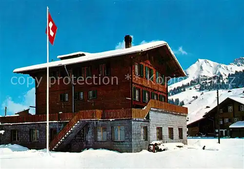 AK / Ansichtskarte Adelboden Ferienheim Trachsel Wintersportplatz Alpen Schweizer Flagge Adelboden