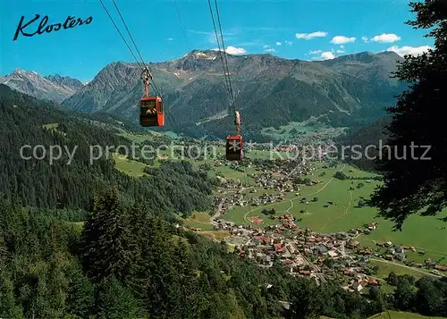 AK / Ansichtskarte Klosters_Dorf und Platz mit Madrisa Bahn Klosters_Dorf