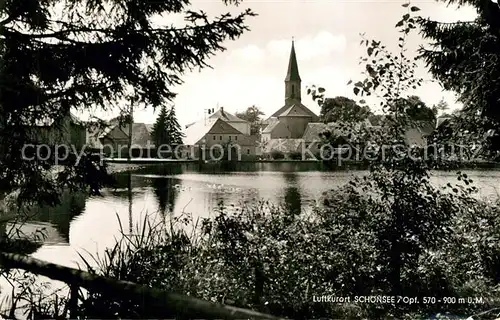 AK / Ansichtskarte Schoensee Teilansicht mit Kirche Schoensee