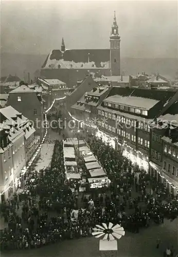 AK / Ansichtskarte Schneeberg_Erzgebirge Ansicht mit Kirche Weihnachtszeit Weihnachtsmarkt Nachtaufnahme Schneeberg Erzgebirge