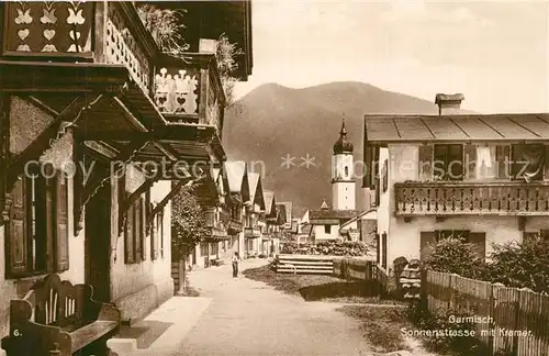 AK / Ansichtskarte Garmisch Partenkirchen Sonnenstrasse mit Kramer Blick zur Kirche Trinks Postkarte Garmisch Partenkirchen