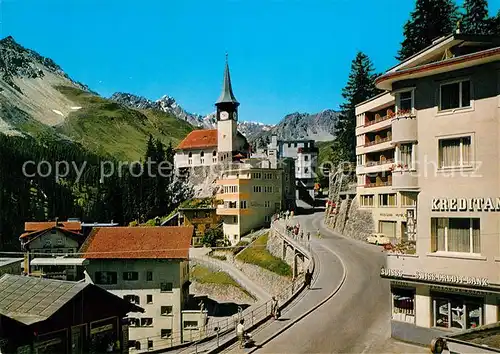 AK / Ansichtskarte Arosa_GR Dorfstrasse mit Kirche Arosa_GR