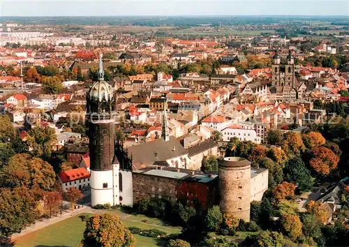 AK / Ansichtskarte Wittenberg_Lutherstadt Fliegeraufnahme mit Schlosskirche Wittenberg_Lutherstadt