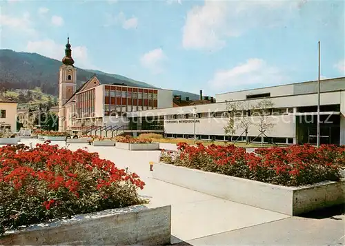 AK / Ansichtskarte Muerzzuschlag Volkshaus und mit Kirche Muerzzuschlag