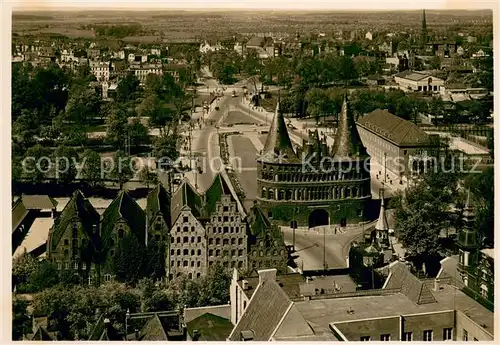 AK / Ansichtskarte Luebeck Holstentor mit Salzspeicher Blick von Petrikirchturm Luebeck