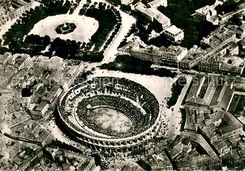 AK / Ansichtskarte Nimes Vue aerienne des arenes Nimes