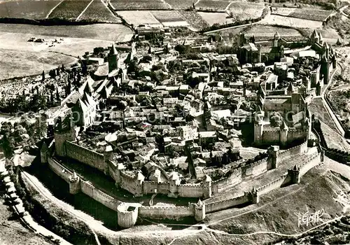 AK / Ansichtskarte Carcassonne Ensemble de la Cite et des Remparts en double Enceinte Vue aerienne Carcassonne