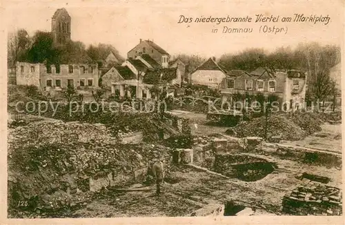 AK / Ansichtskarte Domnau_Ostpreussen Niedergebranntes Viertel am Marktplatz Domnau_Ostpreussen