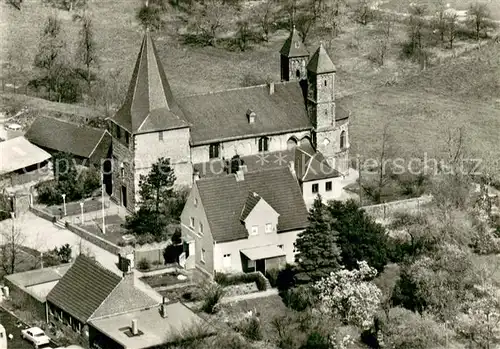 AK / Ansichtskarte Merkenich Pfarrkirche St Amandus Fliegeraufnahme Merkenich