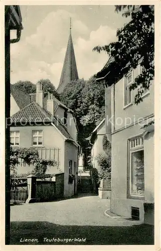 AK / Ansichtskarte Lienen_Westfalen Gassenansicht m. Kirchturm Lienen_Westfalen