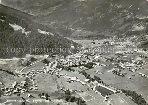 AK / Ansichtskarte Klosters_GR Sommer und Winterkurort Fliegeraufnahme Klosters_GR