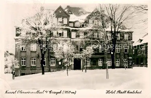 AK / Ansichtskarte Oberwiesenthal_Erzgebirge Hotel Stadt Karlsbad Aussenansicht im Schnee Oberwiesenthal Erzgebirge