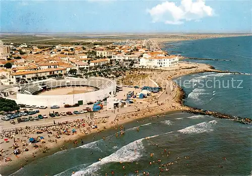 AK / Ansichtskarte Les_Saintes Maries de la Mer Les arenes et la plage vue aerienne Les