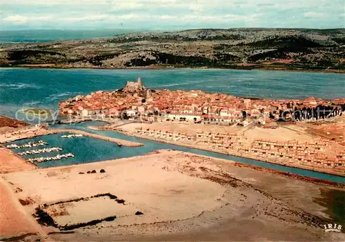 AK / Ansichtskarte Gruissan_Plage Le pittoresque village que domine la Tour de Barberousse Vue aerienne Gruissan_Plage