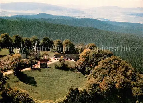 AK / Ansichtskarte Muenchhausen_Christenberg Gaststaette Pension Christenberg Kirche Fliegeraufnahme Muenchhausen_Christenberg