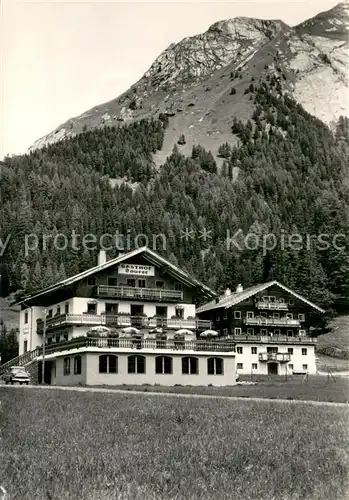 AK / Ansichtskarte Kals_Grossglockner Gasthof Taurer mit Bretterwand Kals Grossglockner