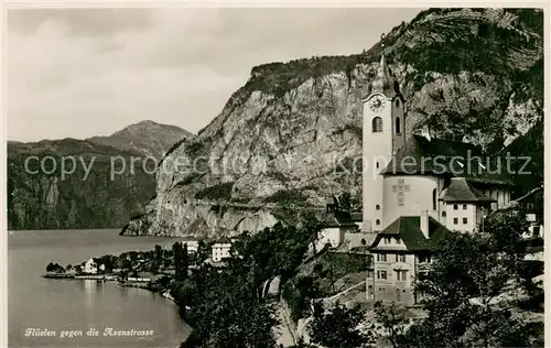 AK / Ansichtskarte Flueelen_Vierwaldstaettersee_UR mit Axenstrasse und Kirche 