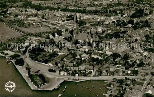 AK / Ansichtskarte Schleswig_Holstein Stadtbild mit Kirche Schlei Schleswig_Holstein