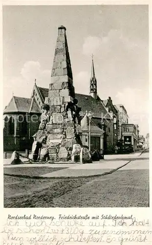 AK / Ansichtskarte Norderney_Nordseebad Friedrichstrasse mit Staedtedenkmal Norderney_Nordseebad