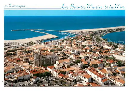 AK / Ansichtskarte Les_Saintes Maries de la Mer Image de la Camargue La ville et le port vue aerienne Les