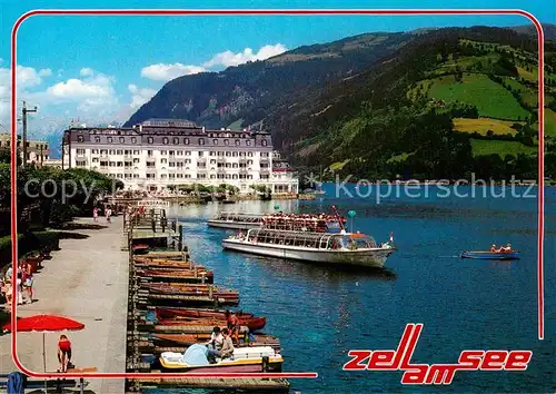 AK / Ansichtskarte Zell_See_AT Seepromenade mit Grand Hotel und Schiffsanlegestelle 