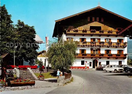 AK / Ansichtskarte Kirchberg_Tirol_AT Strassenpartie mit Bechlwirt Dorfbrunnen und Musikpavillon 