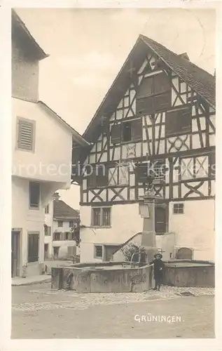 AK / Ansichtskarte Grueningen__ZH Dorfpartie Brunnen Fachwerkhaus 