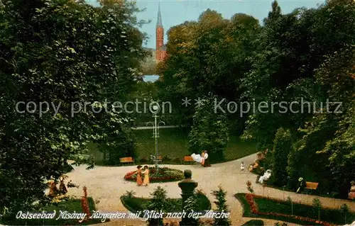 AK / Ansichtskarte 73817460 Misdroy_Ostseebad_Miedzyzdroje_PL Kurgarten mit Blick nach der Kirche 