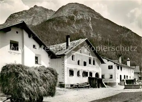 AK / Ansichtskarte  Chamues-ch Dorfpartie mit Piz Mezaun Chamues-ch