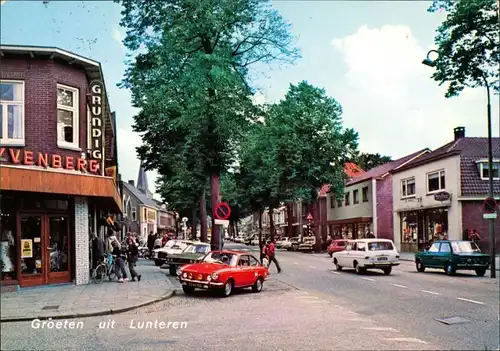 Postkaart Lunteren Dorpsstraat/Autos und Geschäfte 1970